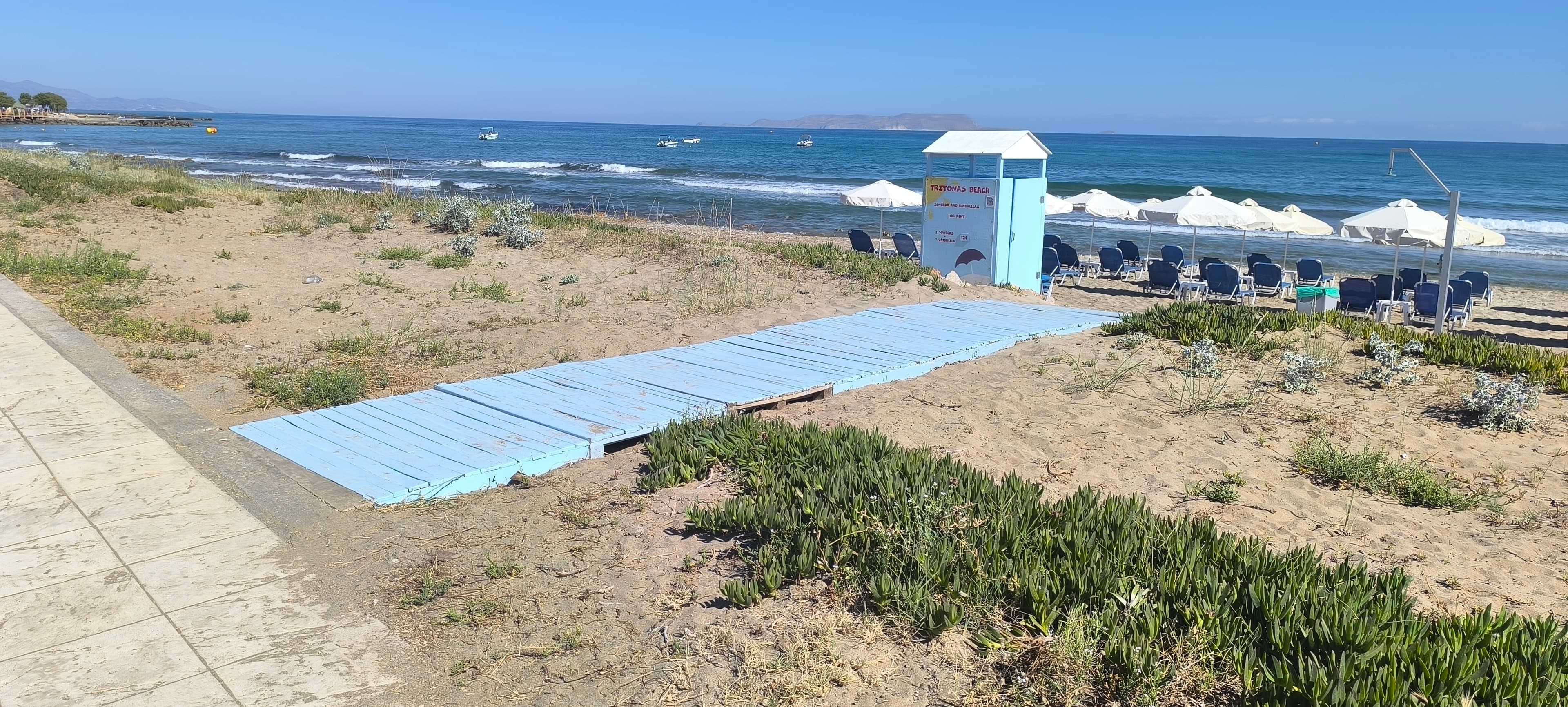 Morning light on Analipsi sand — shallow entry suits calm families